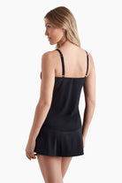 Woman faced left to show detail of  tankini top 