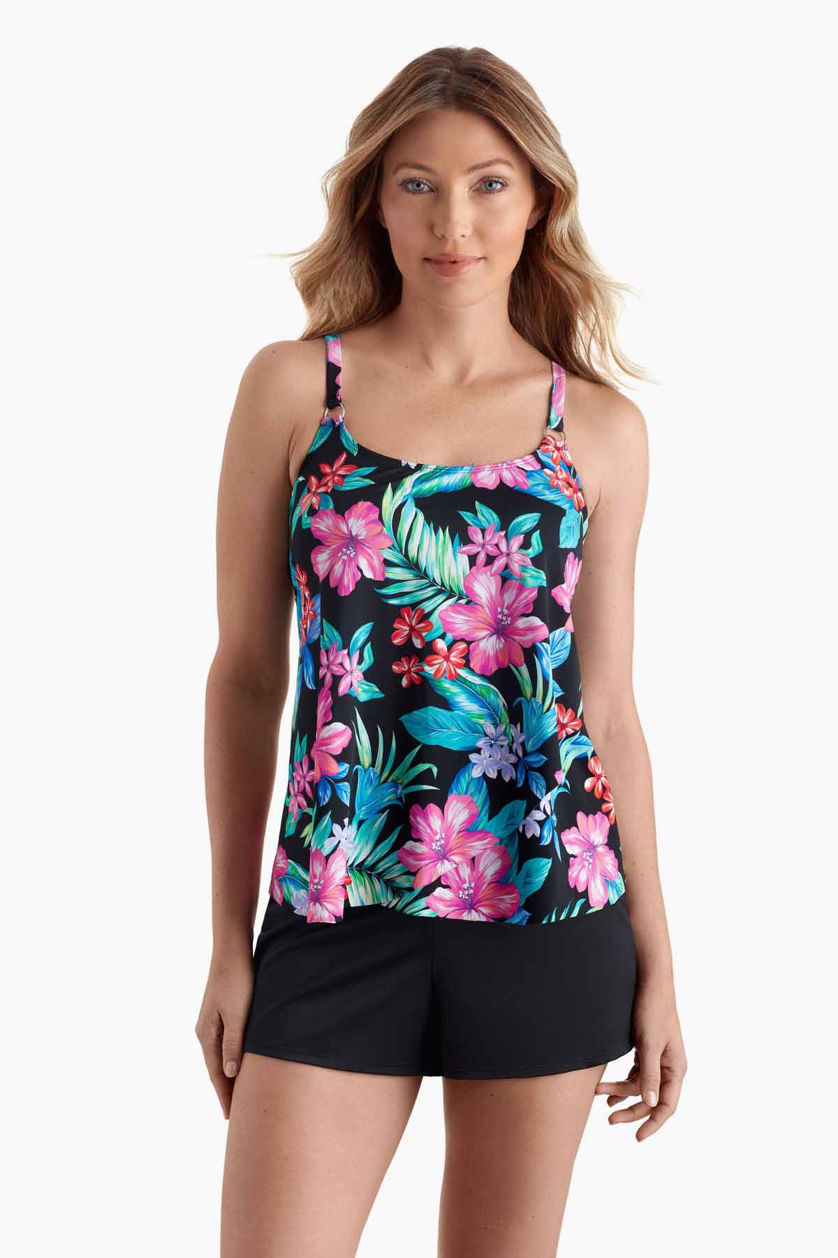 Woman wearing a tankini top with a multicolored floral print