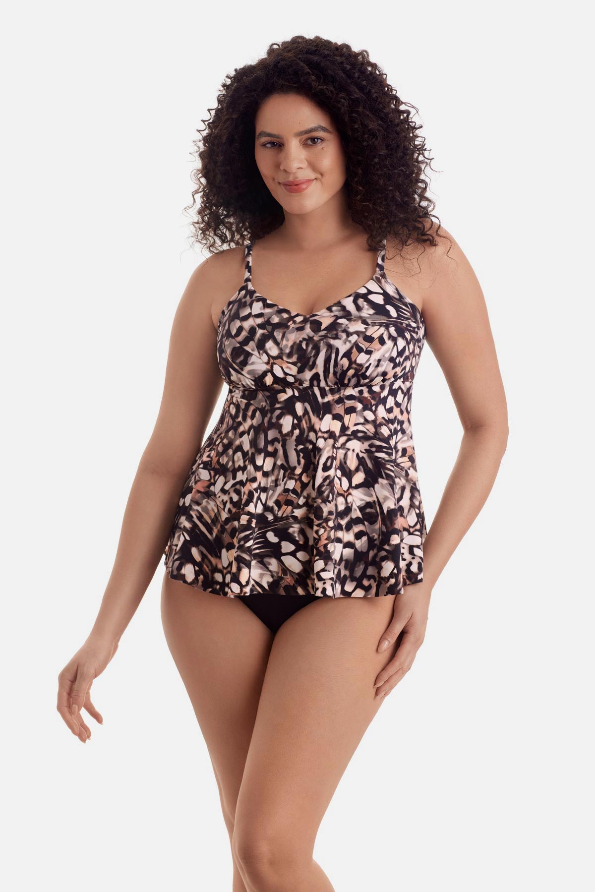 Woman wearing a brown butterfly wing printed tankini top