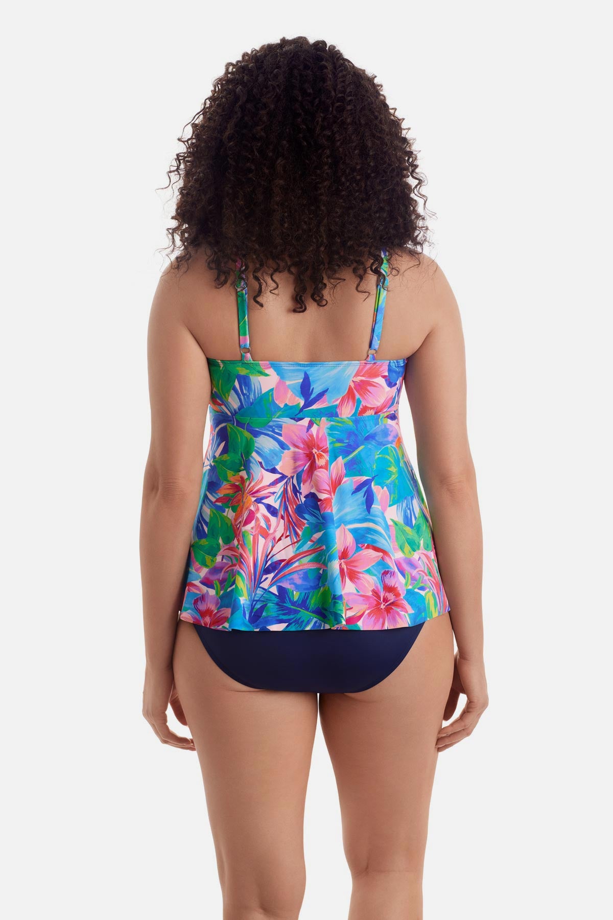 Woman turned away wearing a multicolor floral tankini top