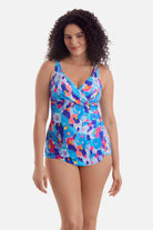 Woman wearing a multicolor abstract printed sarong one-piece swimsuit