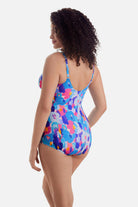 Woman turned left wearing a multicolor abstract printed sarong one-piece swimsuit