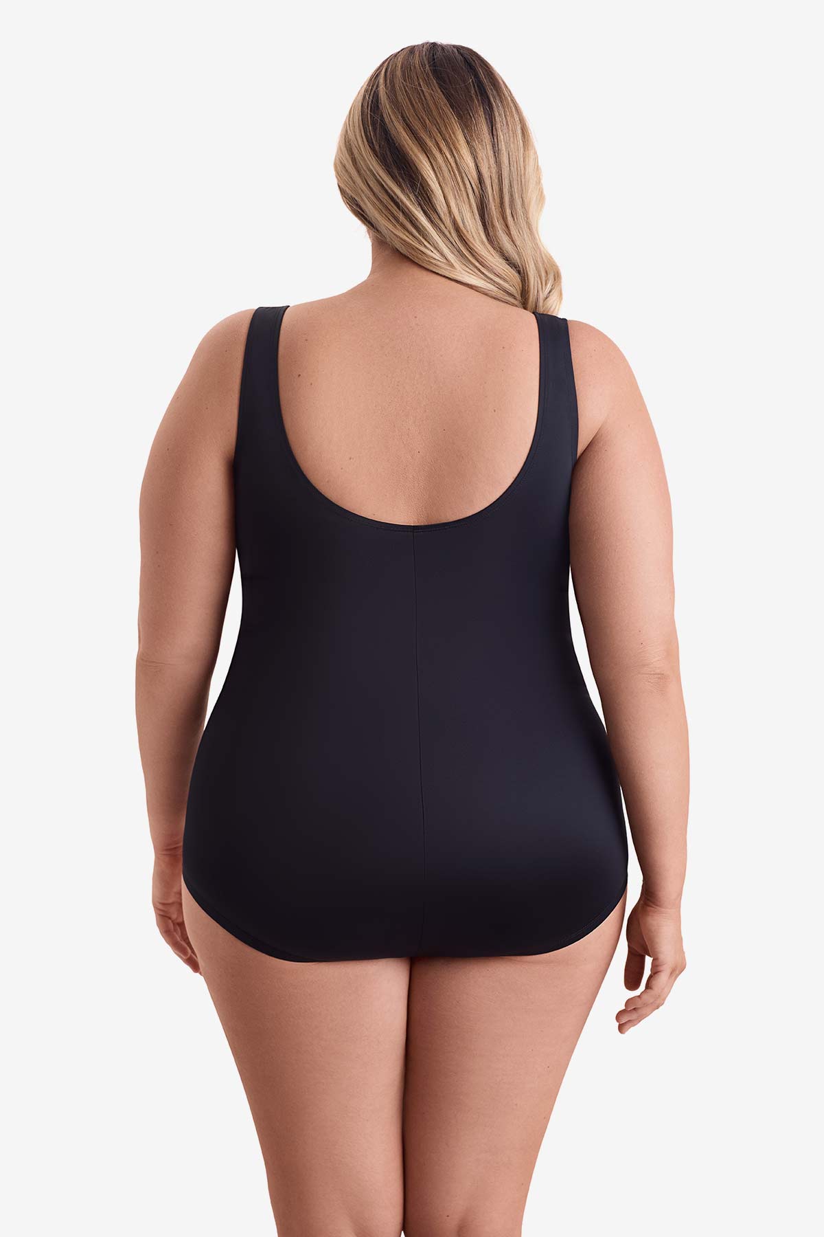 Woman faced away wearing a one-piece swimsuit