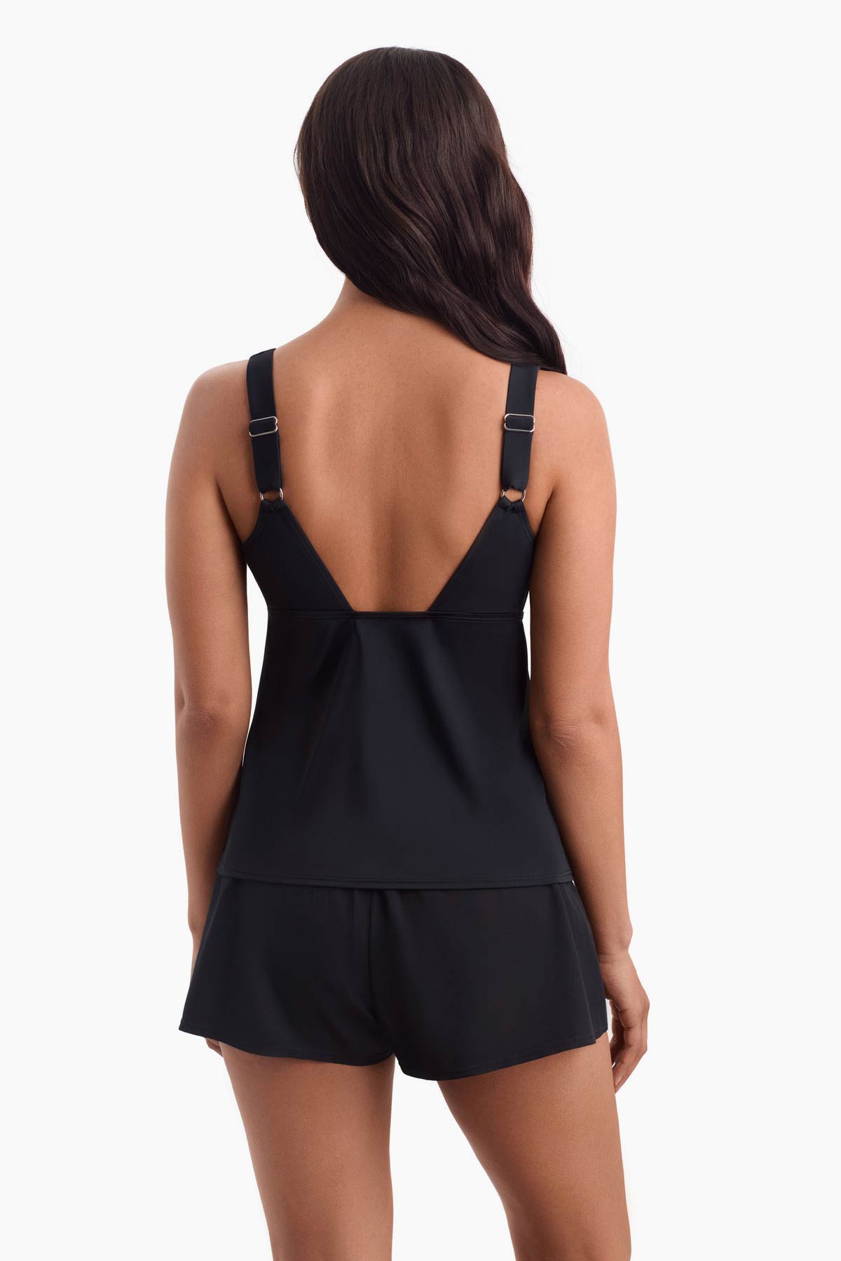 Woman faced away wearing a tankini swim top 