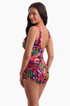 Woman faced left to show side detail of swimsuit