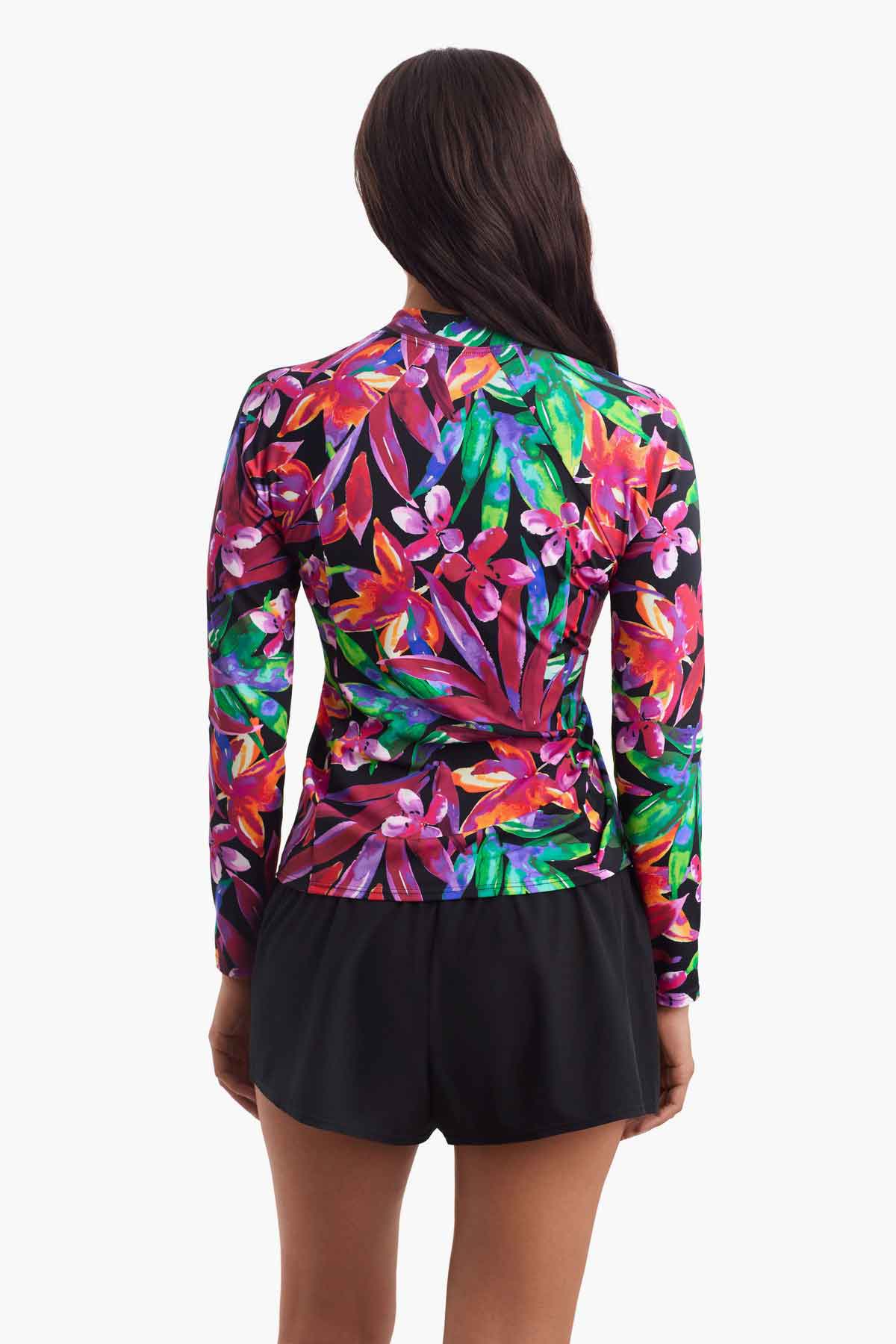 Woman faced away to show detail of the multicolored floral sun shirt