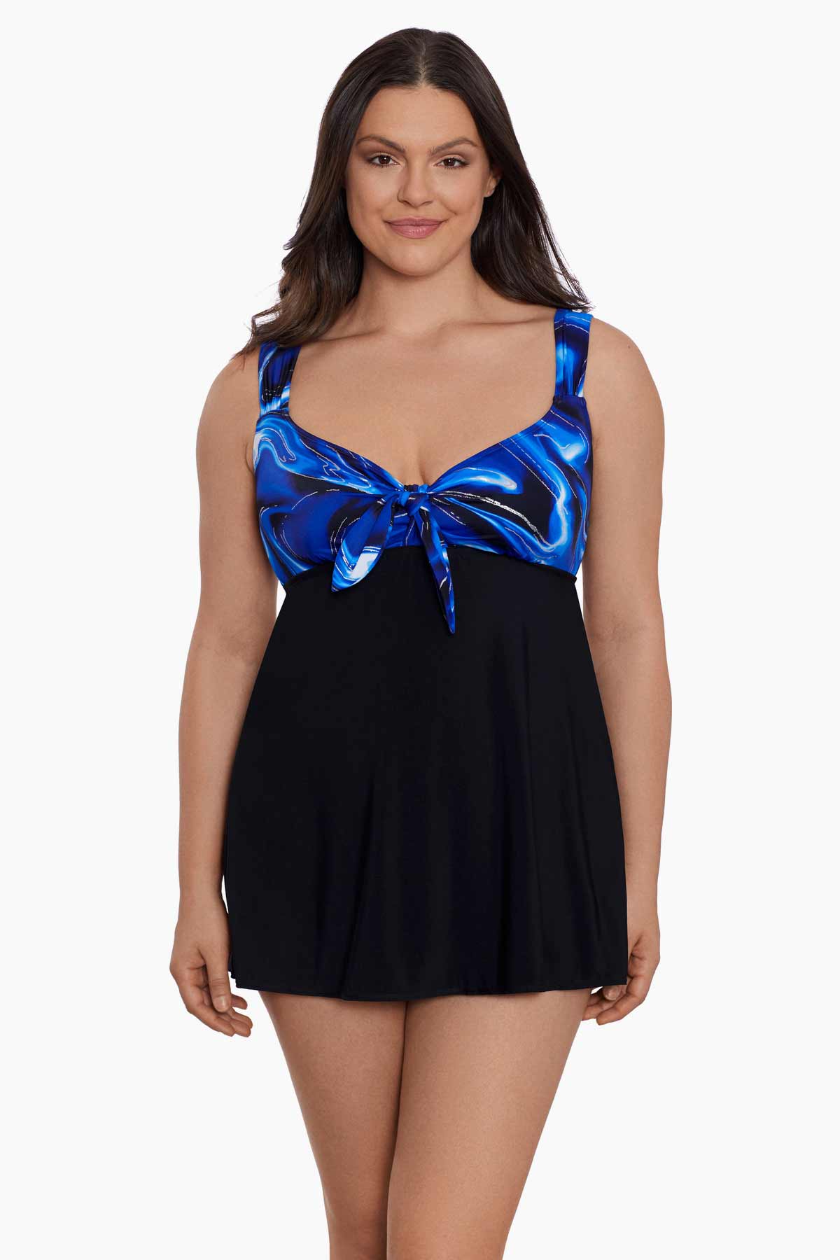 Woman wearing a blue and black oil slick printed bust swim dress