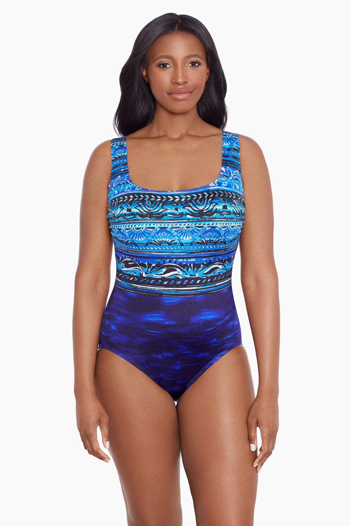 Woman wearing a blue abstract printed one-piece swimsuit
