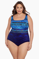 Woman wearing a blue ombre abstract printed one-piece swimsuit
