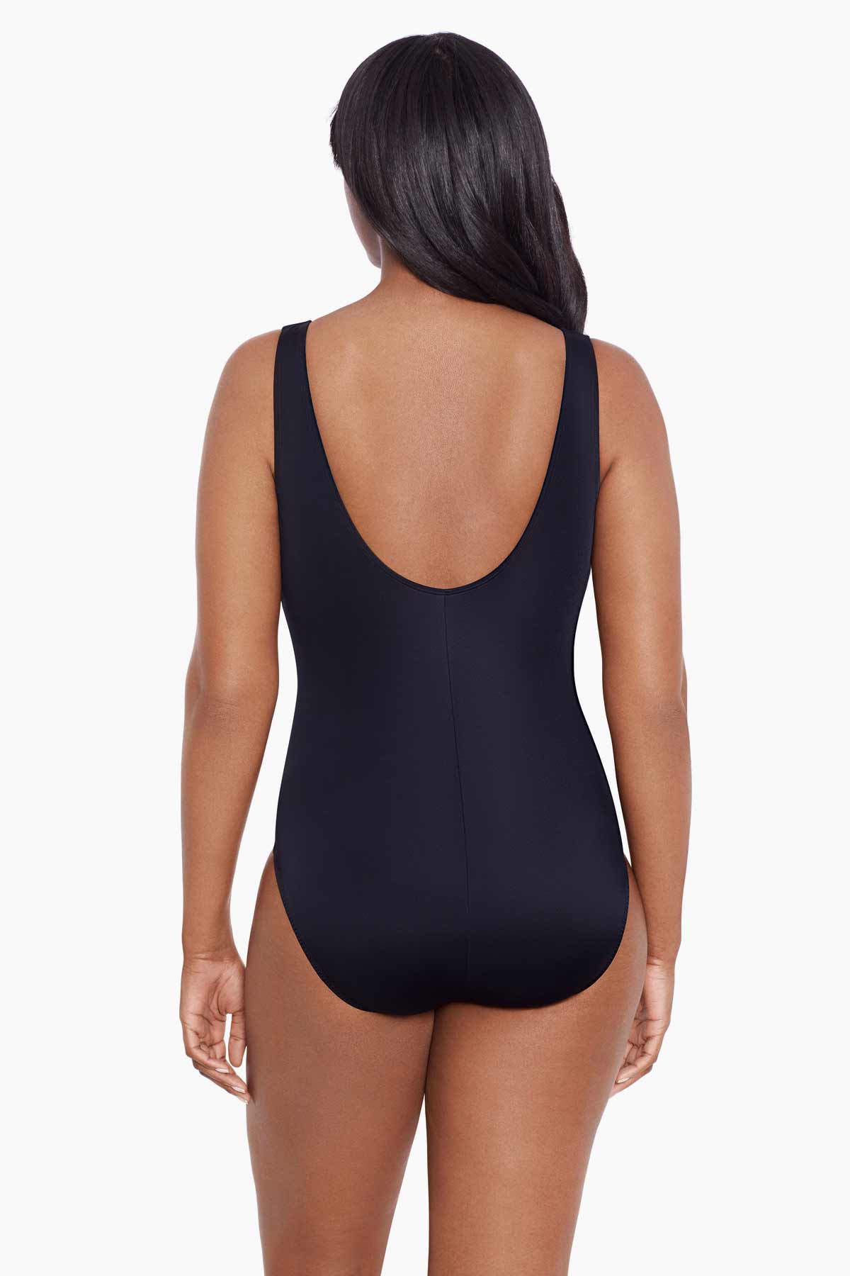 Woman turned away wearing a blue dotted print ruffle neck one-piece swimsuit
