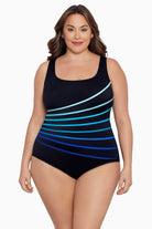 Woman wearing a blue ombre streaked fan tank one-piece swimsuit