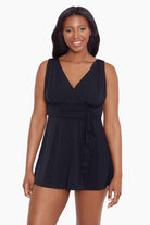 Woman wearing a black V neck swim dress