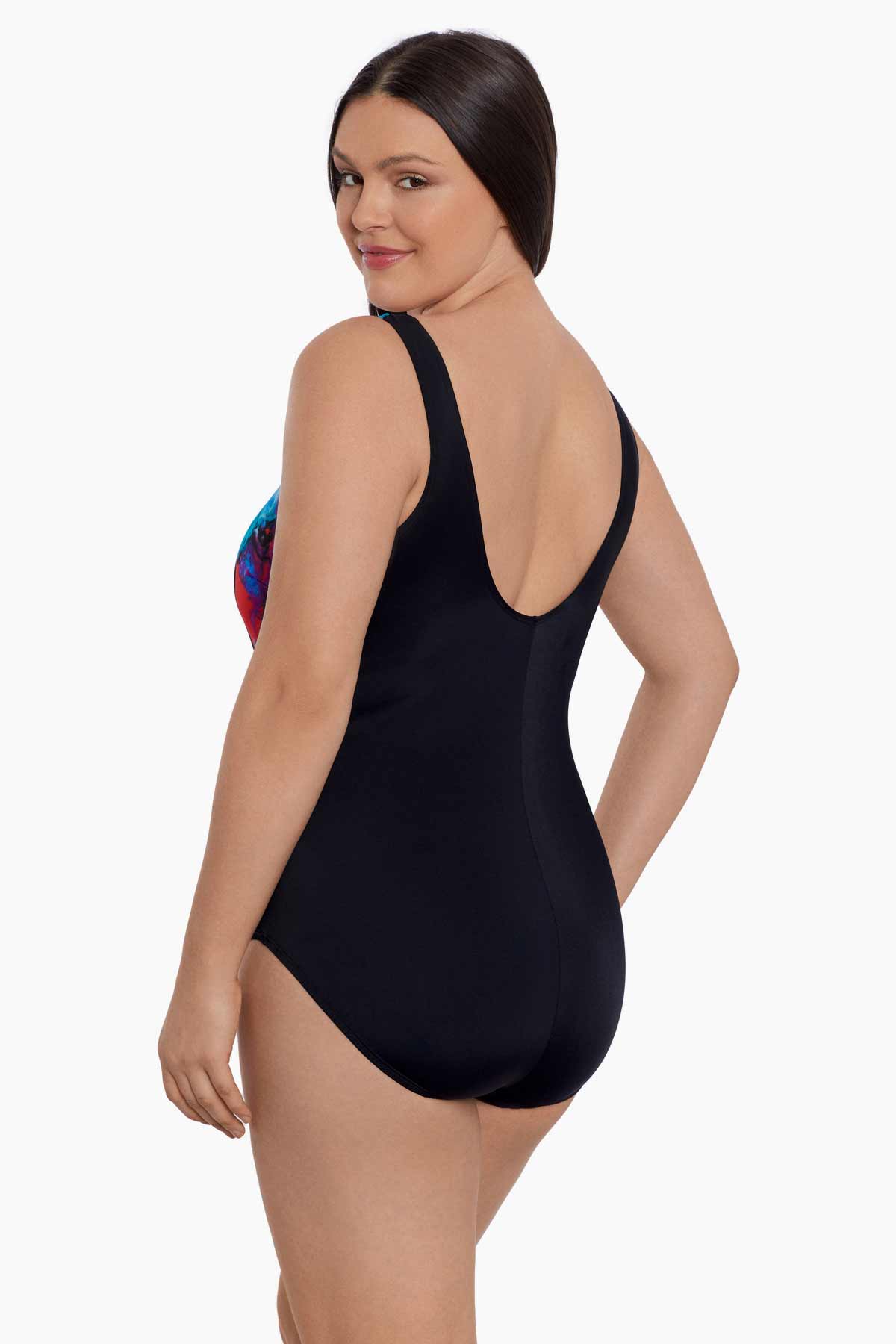 Woman turned left wearing a blue and pink watercolor print one-piece swimsuit