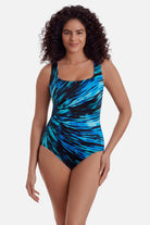 Woman wearing a blue tie-dye one piece swimsuit