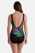 Woman turned away wearing a multicolored feather print one-piece swimsuit 