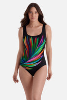 Woman wearing a multicolored feather print one-piece swimsuit 