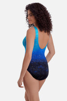 Woman turned left wearing a blue ombre one-piece swimsuit with shimmer detail