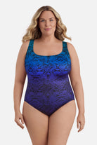 Woman wearing a blue ombre animal-esque printed one-piece swimsuit