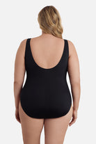 Woman turned away wearing a one-piece swimsuit 