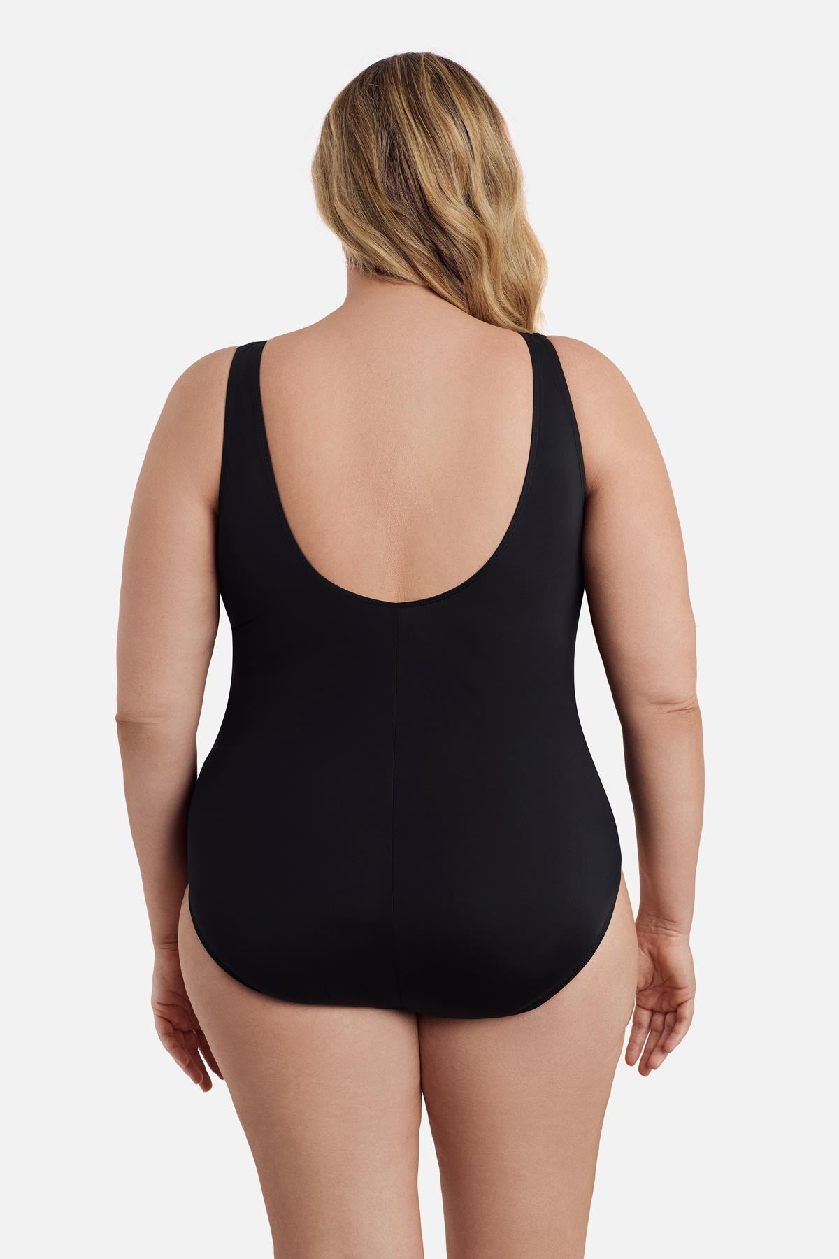 Woman turned away wearing a one-piece swimsuit