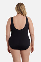 Woman turned away wearing a one-piece swimsuit