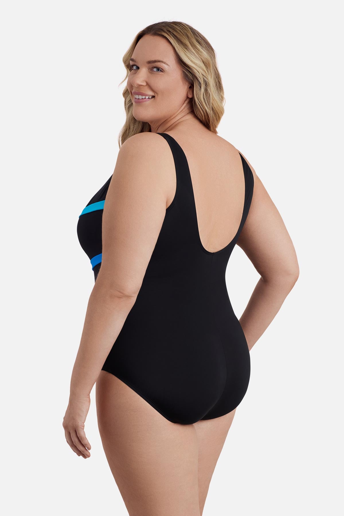 Woman turned left wearing an ombre black and blue striped one-piece swimsuit
