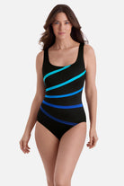 Woman wearing a black swimsuit with gradient blue streaks