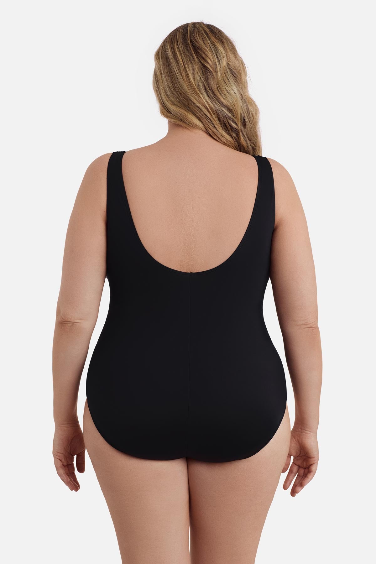 Woman faced away wearing a black one-piece swimsuit