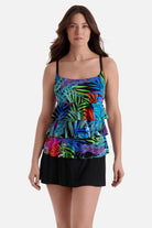 Woman wearing a multicolor palm leaf print faux ruffle skirtini swimsuit
