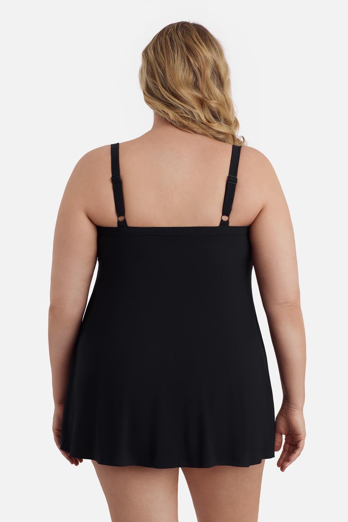 Woman faced away wearing a black swim dress 