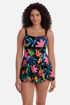Woman wearing a multicolored floral printed swim dress