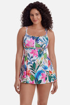 Woman wearing a multicolored floral printed swim dress
