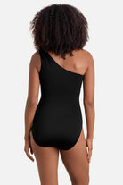 Woman turned away wearing a one shoulder one-piece swimsuit