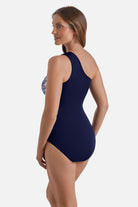Woman turned left wearing a blue and white abstract floral printed one shoulder one-piece swimsuit