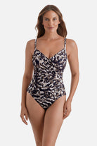 Woman wearing an animal skin printed one-piece swimsuit