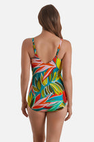 Woman turned away wearing a multicolored abstract printed sarong one-piece swimsuit