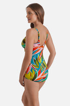 Woman turned left wearing a multicolored abstract printed sarong one-piece swimsuit