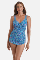 Woman wearing a blue tile printed one-piece sarong swimsuit
