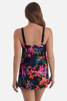 Woman faced away wearing a multicolored floral printed halter swim dress