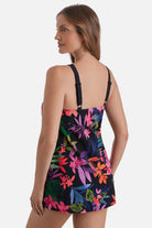 Woman turned left wearing a multicolored floral printed halter swim dress