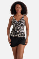 Woman wearing a brown animal-esque printed tankini top