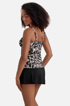 Woman turned left wearing a brown animal-esque printed tankini top