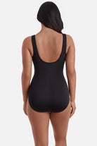 Woman turned away wearing a one-piece swimsuit