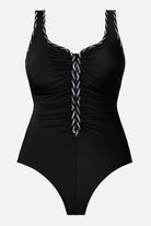 Black one-piece swimsuit with black and white piping on the edges