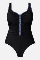 Black one-piece swimsuit with rainbow piping