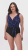 Woman wearing a black and blue safari printed one-piece swimsuit