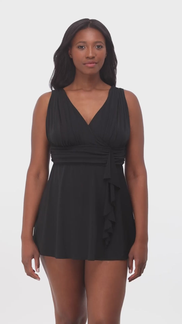 Woman wearing a black V neck swim dress