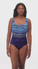 Woman wearing a blue abstract printed one-piece swimsuit