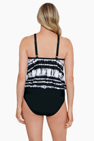 Woman faced away wearing a black and white tie dyed blouson with mesh detail tankini top