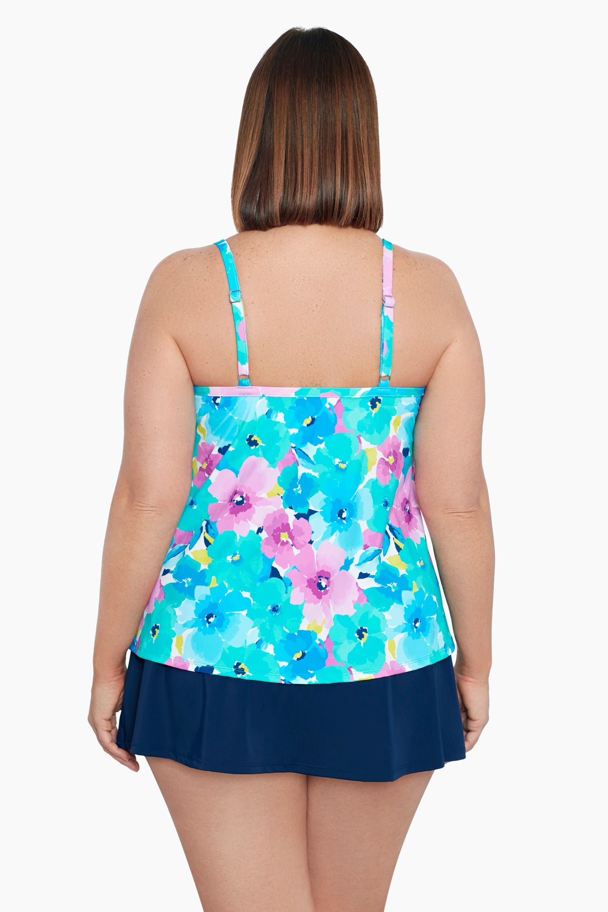 Woman turned away wearing a multicolored floral print middle split tankini top